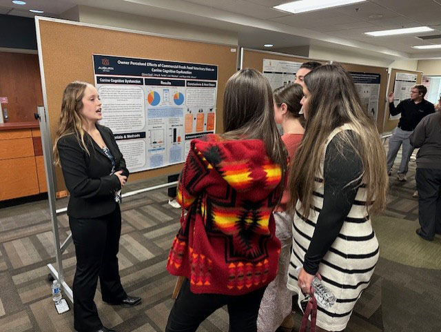 Student presenting poster