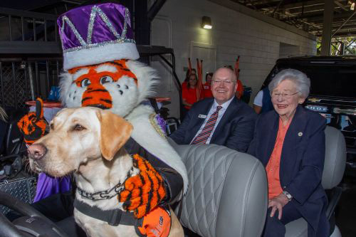 Aubie with dog in golf cart